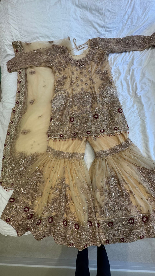 Mongas champagne, nude, gold gharara with red olive accents