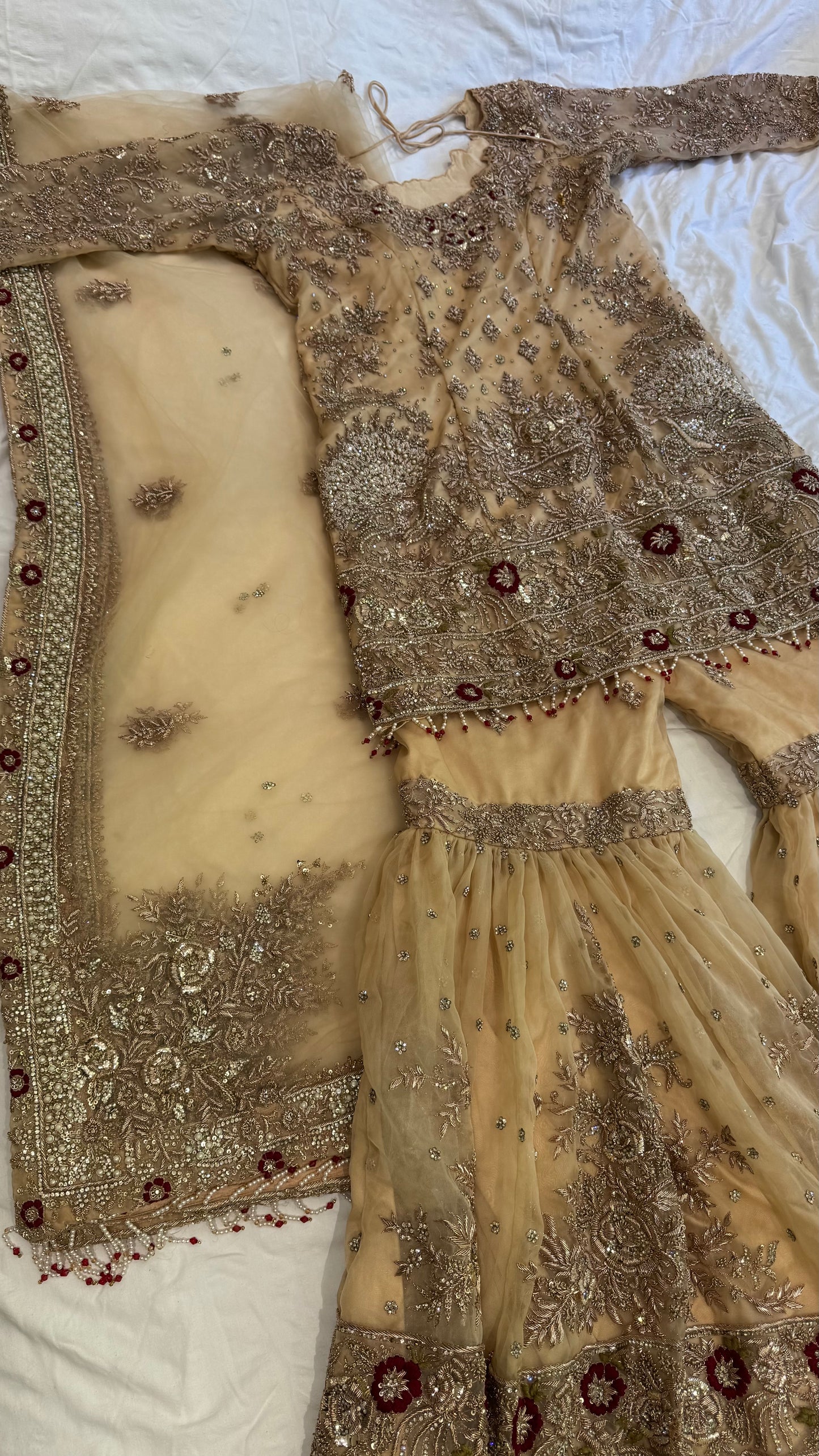 Mongas champagne, nude, gold gharara with red olive accents