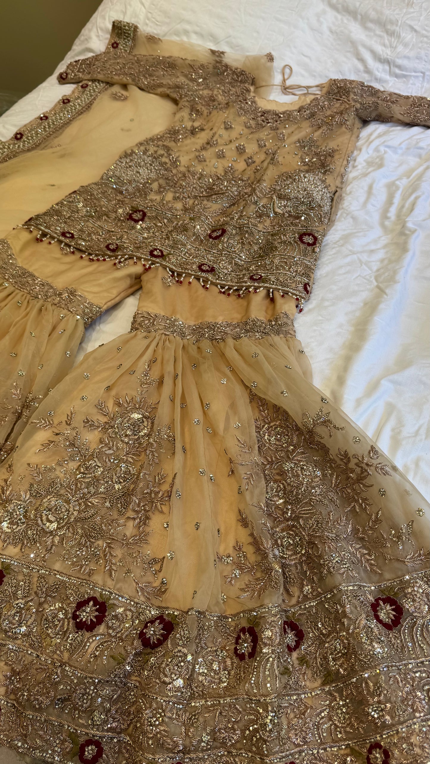 Mongas champagne, nude, gold gharara with red olive accents