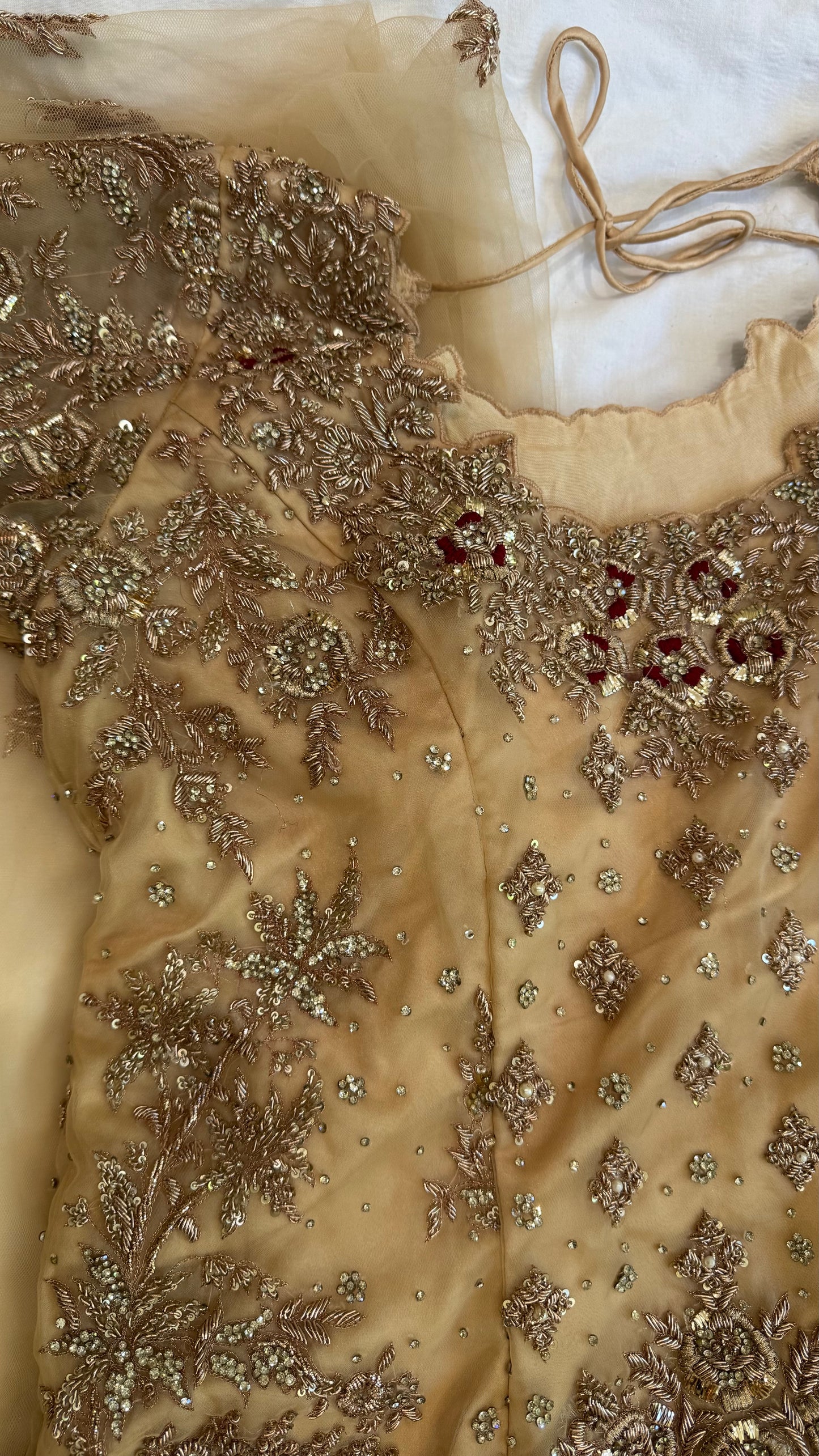 Mongas champagne, nude, gold gharara with red olive accents