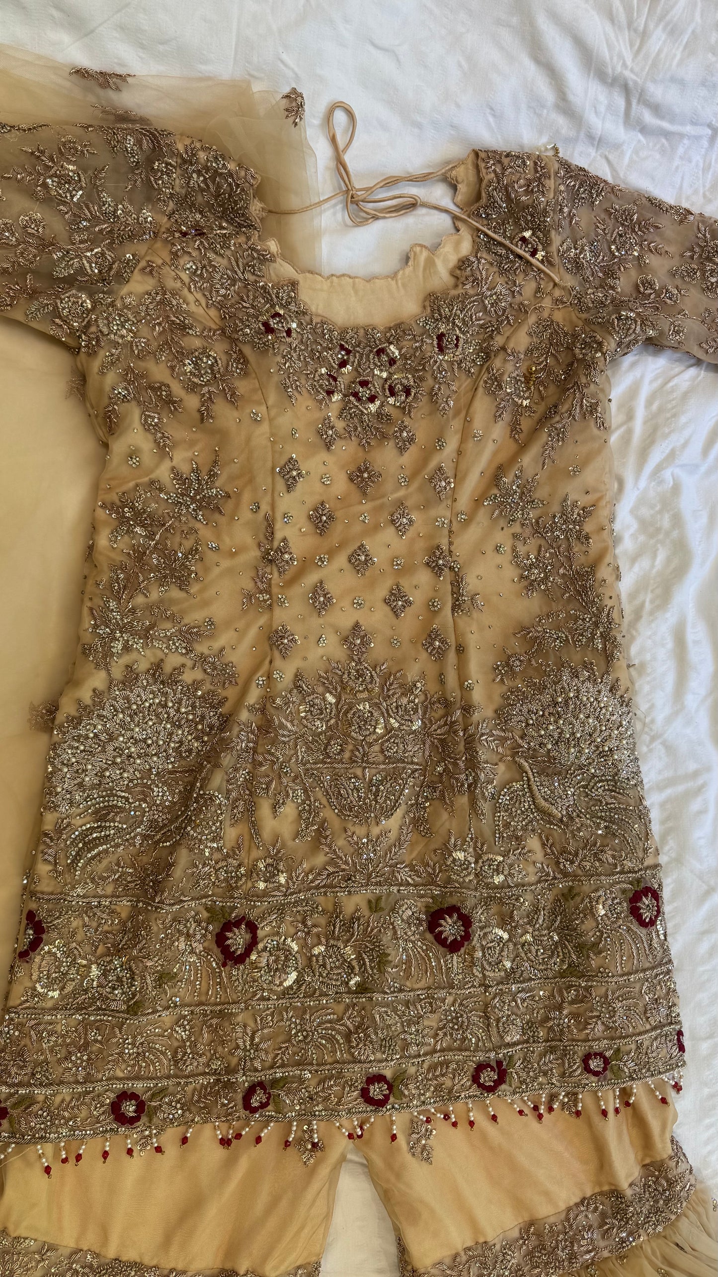 Mongas champagne, nude, gold gharara with red olive accents